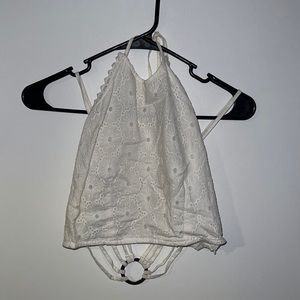 High neck open back crop in white. US size small